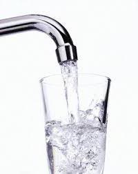 Tap filling a glass of water