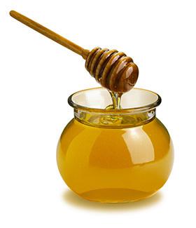 Pot of honey in use 
