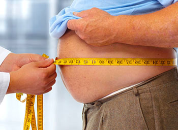 Mans belly being measured